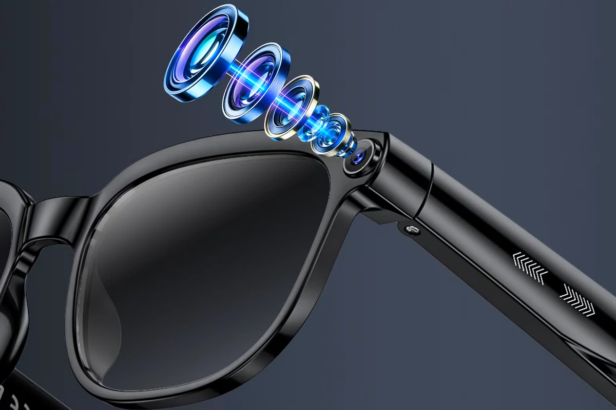 AI smart glasses with camera and translation on a desk beside a phone